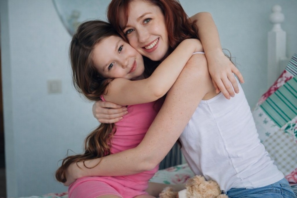 Mom and daughter hugging warmly